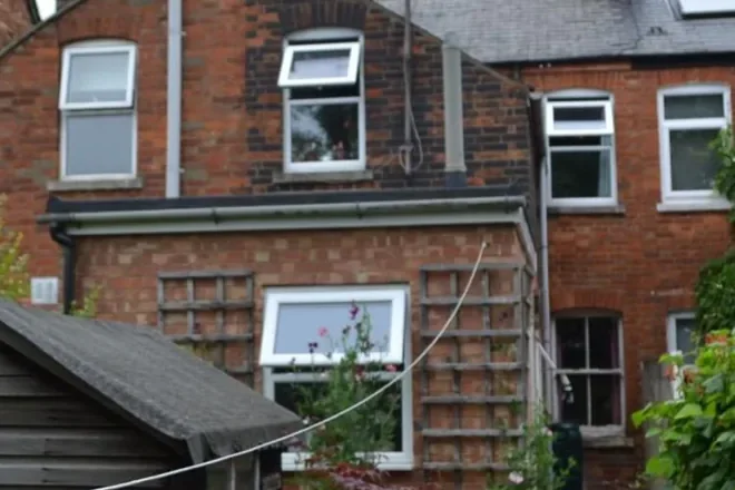 Rear elevation of a brick terraced house in East Oxford