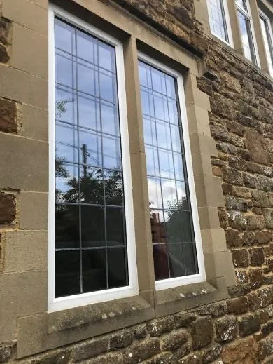Mullioned window in the dressed-stone surround seen from outside